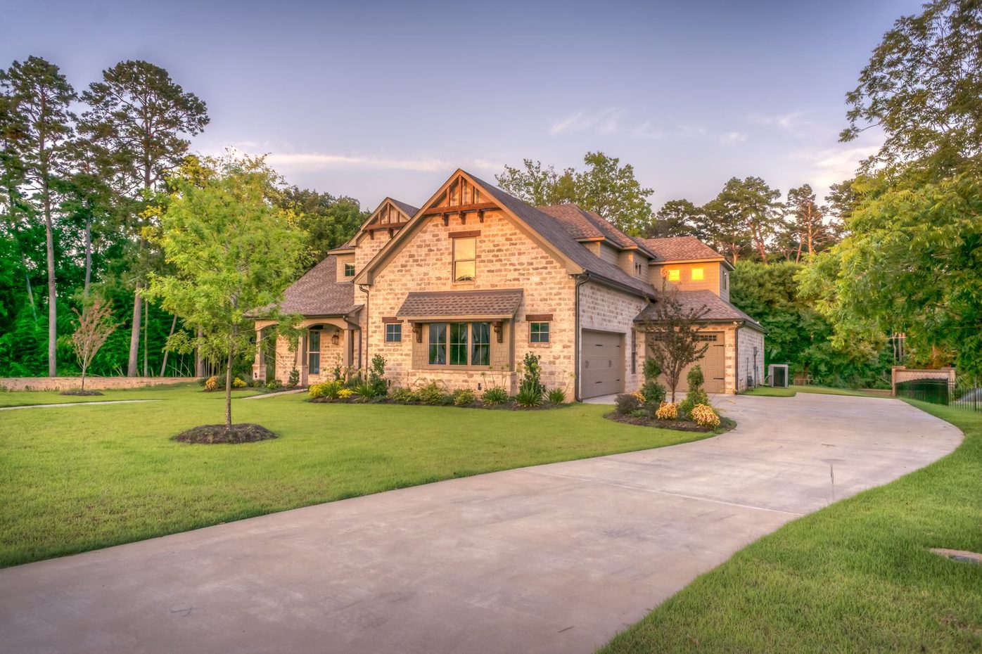 Two-story craftsman-style home with a dark multi-gable shingle roof